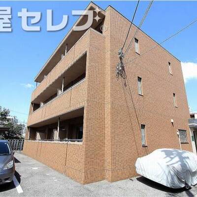 
						茶色のタイル張りのおしゃれなマンション